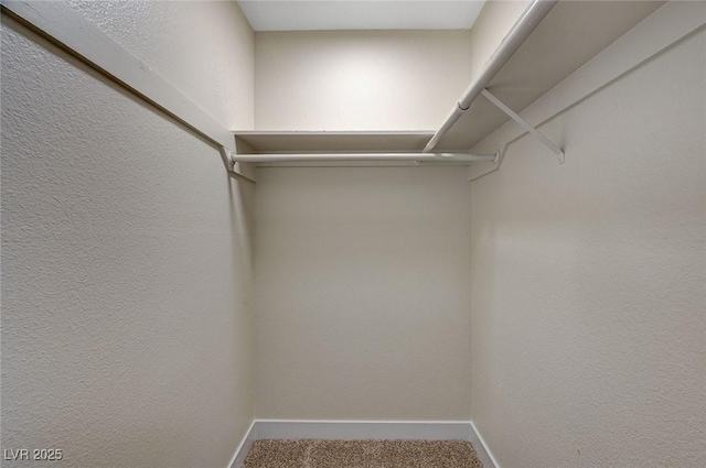 4804 Apawana Ln, Las Vegas, NV 89108 - spacious closet featuring carpet floors