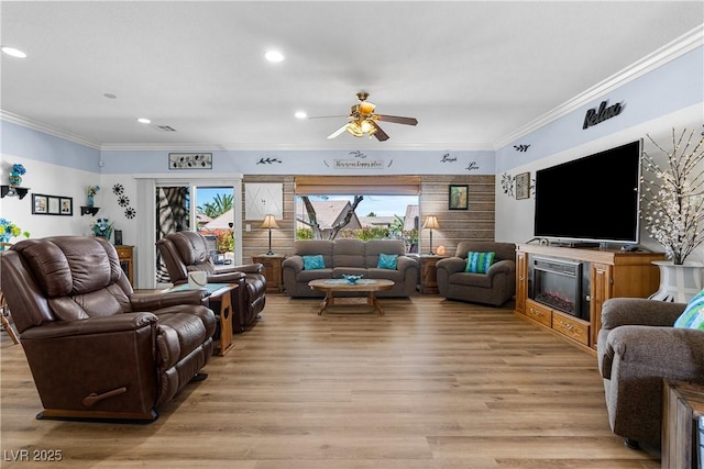 2606 Crested Butte St, Henderson, NV 89052 - living area with crown molding, ceiling fan, recessed lighting, and light wood-style flooring