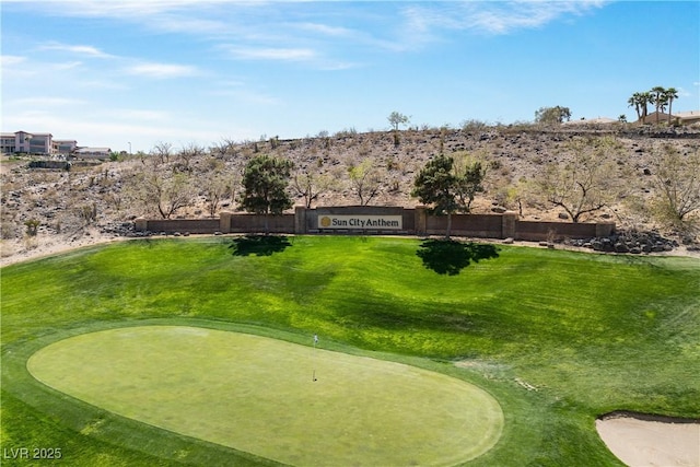 2606 Crested Butte St, Henderson, NV 89052 - view of community with a putting area, golf course view, and a yard