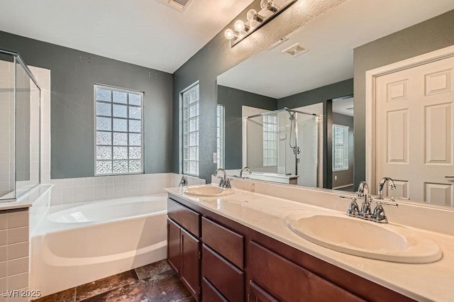 6349 Blushing Willow St, North Las Vegas, NV 89081 - bathroom with a bath, a stall shower, and double vanity