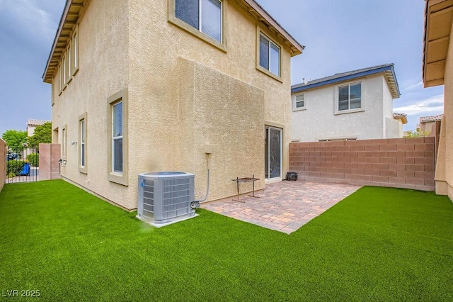 6349 Blushing Willow St, North Las Vegas, NV 89081 - rear view of property featuring stucco siding, a fenced backyard, and a patio area