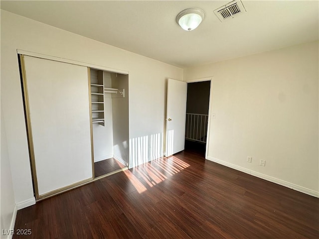 1332 Wheatland Way, Las Vegas, NV 89128 - unfurnished bedroom featuring a closet and wood finished floors