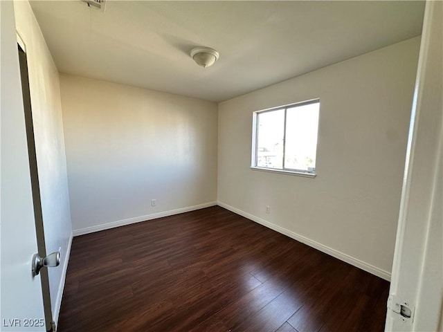 1332 Wheatland Way, Las Vegas, NV 89128 - empty room featuring dark wood-style flooring and baseboards