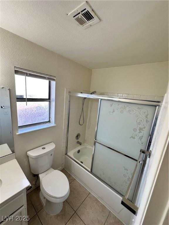 1332 Wheatland Way, Las Vegas, NV 89128 - bathroom with vanity, tile patterned flooring, enclosed tub / shower combo, and a textured ceiling