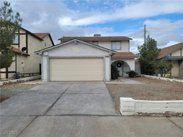 1332 Wheatland Way, Las Vegas, NV 89128 - traditional-style home with concrete driveway, a garage, and stucco siding