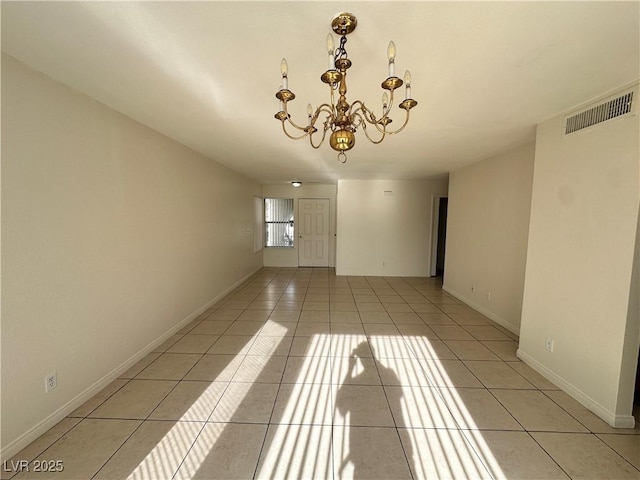 1332 Wheatland Way, Las Vegas, NV 89128 - spare room featuring light tile patterned floors and a chandelier