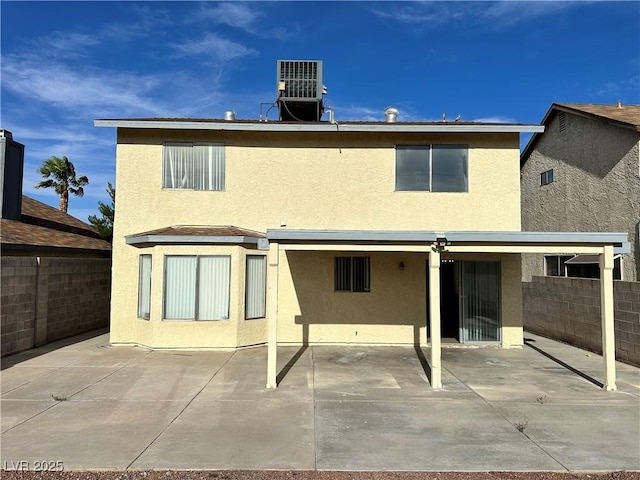 1332 Wheatland Way, Las Vegas, NV 89128 - rear view of house featuring stucco siding and a patio