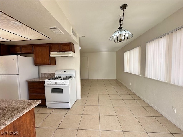 1332 Wheatland Way, Las Vegas, NV 89128 - kitchen featuring white appliances, a chandelier, light tile patterned flooring, and under cabinet range hood