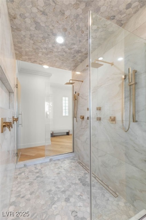 8617 Titleist Cir, Las Vegas, NV 89117 - full bath featuring a marble finish shower, crown molding, and a baseboard heating unit