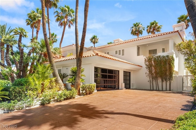 8617 Titleist Cir, Las Vegas, NV 89117 - mediterranean / spanish house with a tiled roof and stucco siding