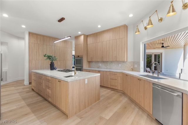 8617 Titleist Cir, Las Vegas, NV 89117 - kitchen featuring stainless steel appliances, light brown cabinetry, modern cabinets, light wood-type flooring, and recessed lighting