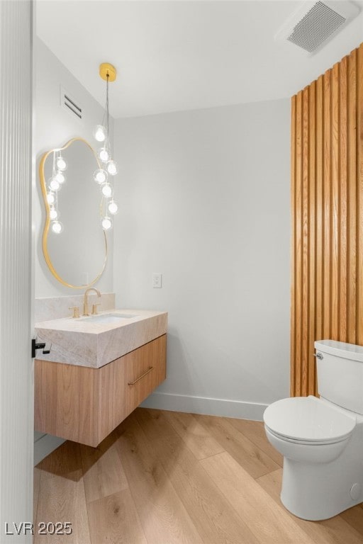 8617 Titleist Cir, Las Vegas, NV 89117 - bathroom featuring wood finished floors and vanity