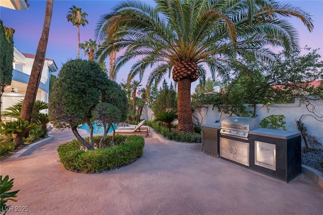 8617 Titleist Cir, Las Vegas, NV 89117 - view of property's community with an outdoor kitchen and a patio