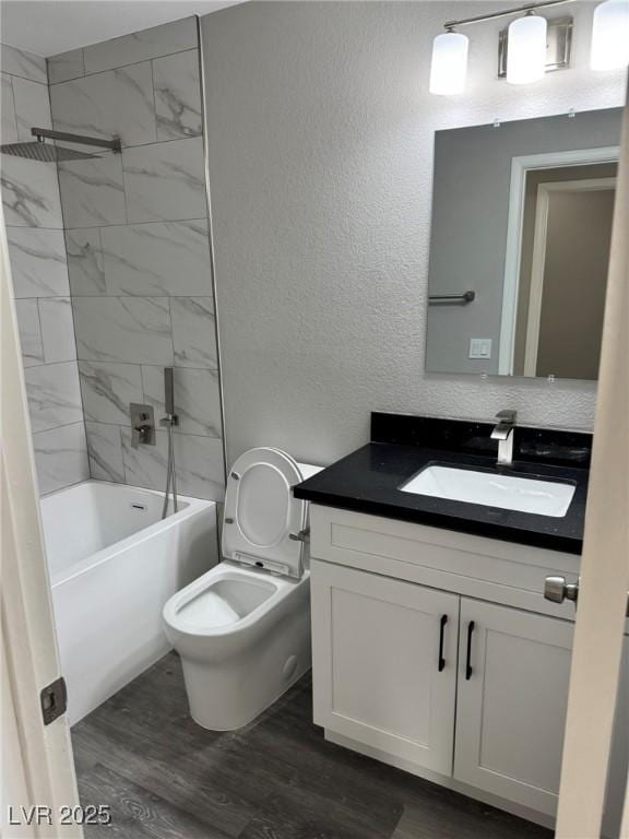 621 Carlos Julio Ave, North Las Vegas, NV 89031 - full bath featuring vanity, a textured wall, wood finished floors, and shower / bathtub combination