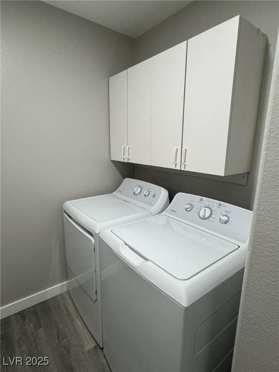 621 Carlos Julio Ave, North Las Vegas, NV 89031 - laundry room featuring washer and clothes dryer, cabinet space, and dark wood-style flooring