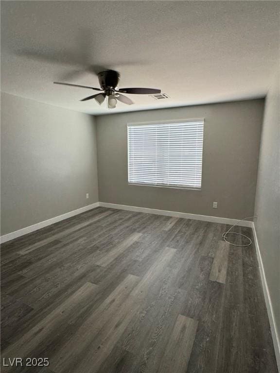621 Carlos Julio Ave, North Las Vegas, NV 89031 - empty room featuring dark wood-style floors, ceiling fan, and a textured ceiling