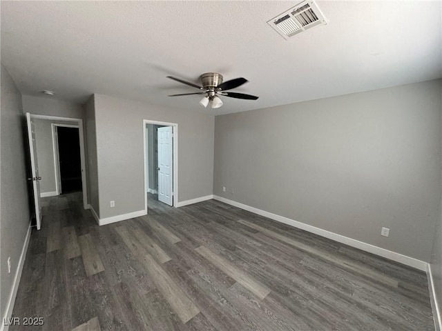 621 Carlos Julio Ave, North Las Vegas, NV 89031 - spare room featuring dark wood finished floors, a ceiling fan, and a textured ceiling