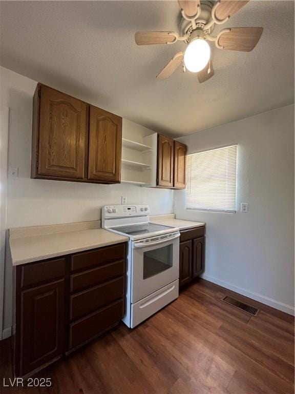 2170 W Gally Rd, Pahrump, NV 89060 - kitchen with white range with electric cooktop, open shelves, light countertops, dark wood-style floors, and a textured ceiling