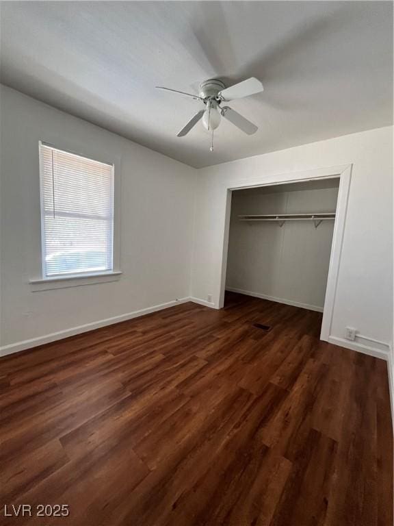 2170 W Gally Rd, Pahrump, NV 89060 - unfurnished bedroom with wood finished floors, a closet, and ceiling fan