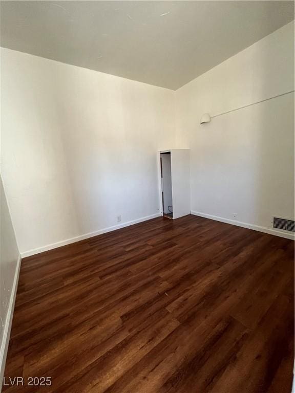 2170 W Gally Rd, Pahrump, NV 89060 - unfurnished room with dark wood finished floors and baseboards