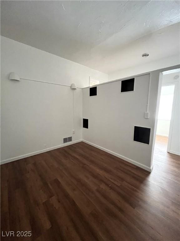 2170 W Gally Rd, Pahrump, NV 89060 - spare room featuring dark wood-style flooring and baseboards