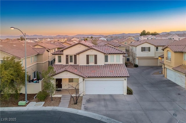 6005 Bristol Crest Ln, Las Vegas, NV 89139 - view of front facade featuring a residential view, a garage, concrete driveway, and stucco siding