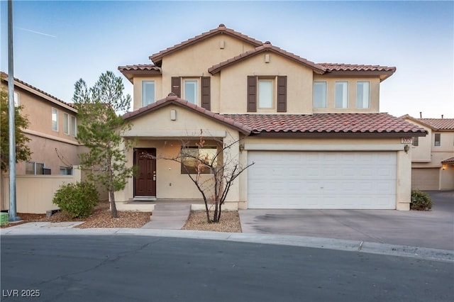 6005 Bristol Crest Ln, Las Vegas, NV 89139 - view of front facade with a tiled roof, stucco siding, a garage, and driveway
