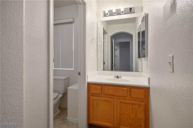 6005 Bristol Crest Ln, Las Vegas, NV 89139 - bathroom featuring vanity, a textured wall, and tile patterned floors