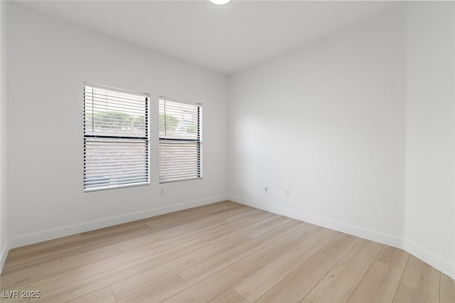 8250 N Grand Canyon Dr Unit 1050, Las Vegas, NV 89166 - unfurnished room with light wood-style floors and baseboards