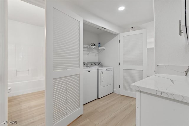 8250 N Grand Canyon Dr Unit 1050, Las Vegas, NV 89166 - washroom with light wood-style floors, independent washer and dryer, and recessed lighting