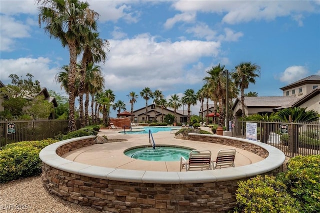 8250 N Grand Canyon Dr Unit 1050, Las Vegas, NV 89166 - view of community with a hot tub and a swimming pool