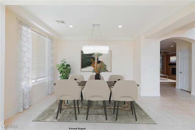7112 Rancho De Taos Ct, Las Vegas, NV 89130 - dining space with arched walkways, a chandelier, recessed lighting, and light tile patterned flooring