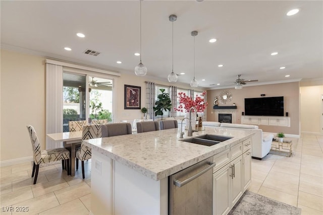 7112 Rancho De Taos Ct, Las Vegas, NV 89130 - kitchen featuring a ceiling fan, stainless steel dishwasher, crown molding, recessed lighting, and a fireplace