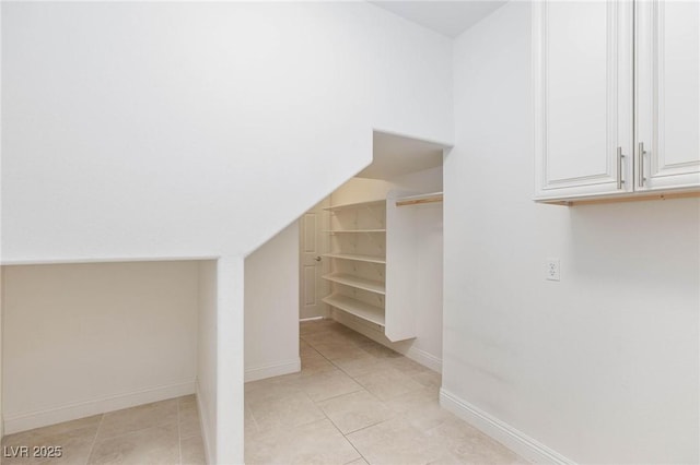 7112 Rancho De Taos Ct, Las Vegas, NV 89130 - spacious closet with light tile patterned floors