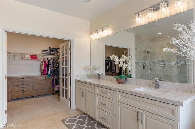 7112 Rancho De Taos Ct, Las Vegas, NV 89130 - bathroom with a stall shower, double vanity, a spacious closet, and tile patterned floors