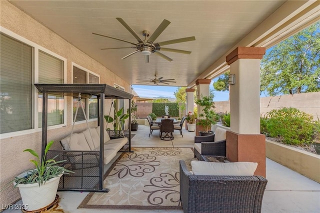 7112 Rancho De Taos Ct, Las Vegas, NV 89130 - fenced backyard with outdoor dining space, an outdoor living space, a patio area, and a ceiling fan