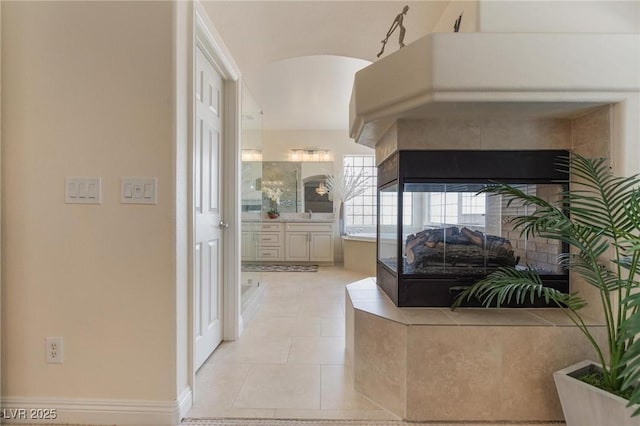 7112 Rancho De Taos Ct, Las Vegas, NV 89130 - hall featuring light tile patterned floors and arched walkways