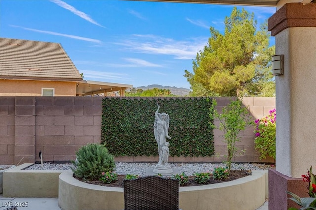 7112 Rancho De Taos Ct, Las Vegas, NV 89130 - fenced backyard featuring a mountain view
