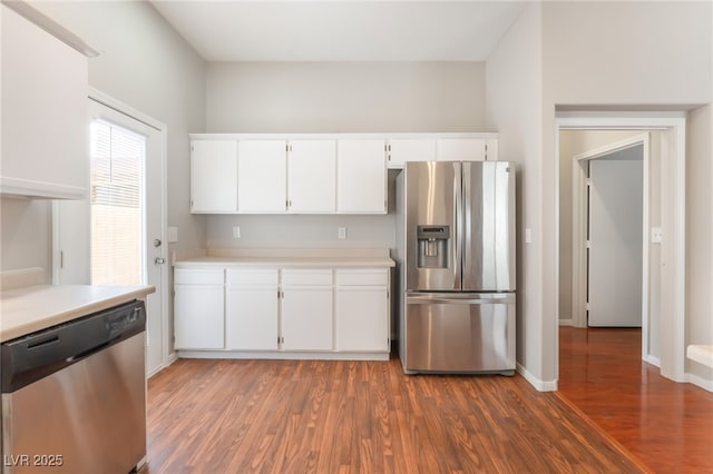 1635 Otto Merida Ave, Las Vegas, NV 89106 - kitchen featuring appliances with stainless steel finishes, light countertops, wood finished floors, and white cabinetry