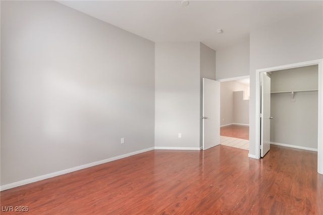 1635 Otto Merida Ave, Las Vegas, NV 89106 - unfurnished bedroom with wood finished floors, a closet, and a spacious closet