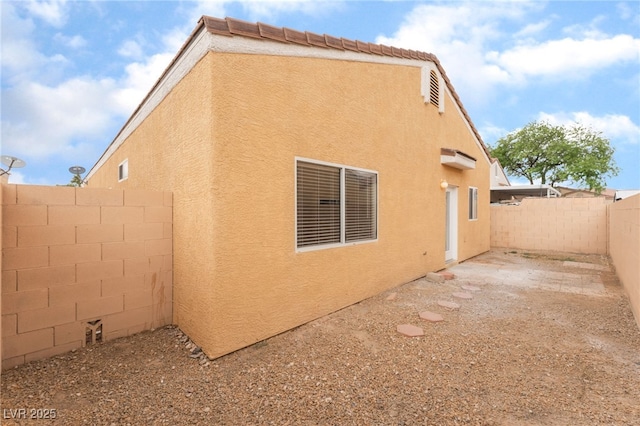 1635 Otto Merida Ave, Las Vegas, NV 89106 - view of home's exterior featuring stucco siding and a fenced backyard