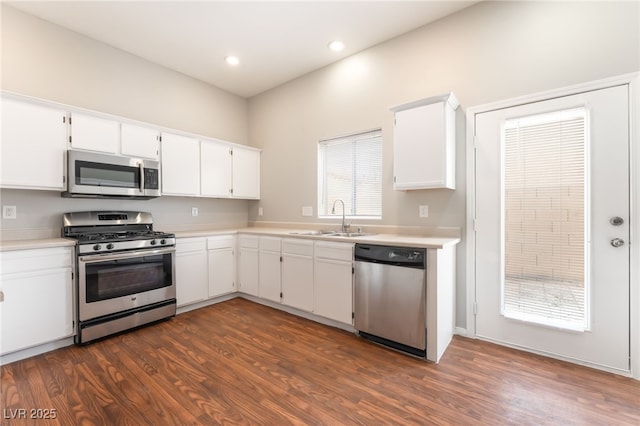 1635 Otto Merida Ave, Las Vegas, NV 89106 - kitchen with stainless steel appliances, light countertops, dark wood-style floors, and recessed lighting