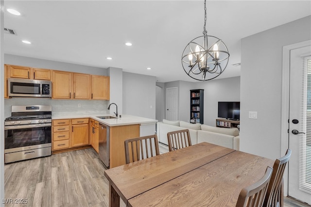 9074 Maycott Ave, Las Vegas, NV 89148 - dining area featuring a chandelier, light wood finished floors, and recessed lighting