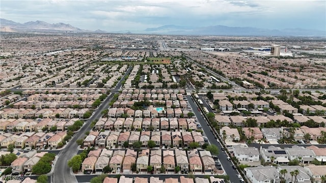 9074 Maycott Ave, Las Vegas, NV 89148 - aerial overview of property's location with nearby suburban area and a mountainous background