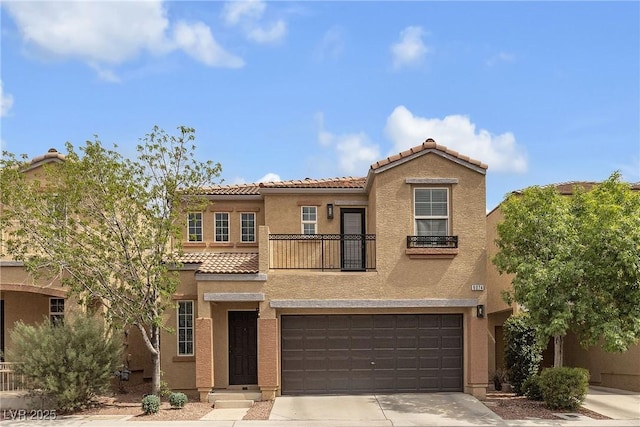 9074 Maycott Ave, Las Vegas, NV 89148 - view of front of home with stucco siding, a garage, a tile roof, driveway, and a balcony