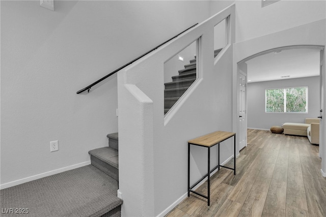 9074 Maycott Ave, Las Vegas, NV 89148 - stairway with arched walkways and wood finished floors