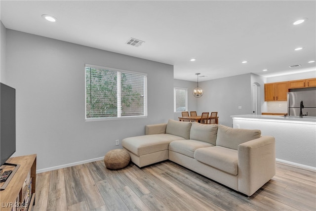 9074 Maycott Ave, Las Vegas, NV 89148 - living area with light wood-style floors, recessed lighting, and a chandelier
