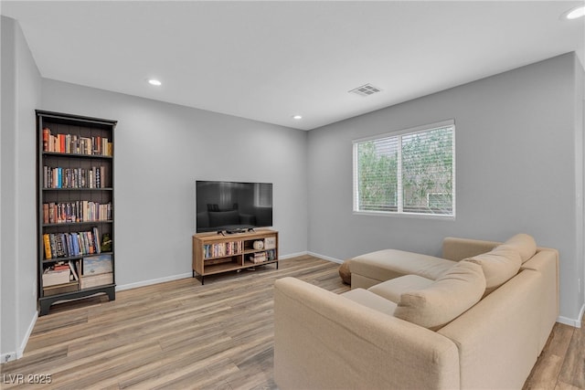 9074 Maycott Ave, Las Vegas, NV 89148 - living room featuring light wood-style flooring and recessed lighting