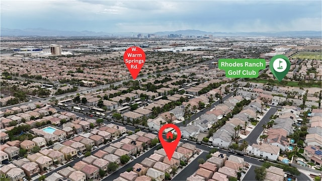 9074 Maycott Ave, Las Vegas, NV 89148 - aerial overview of property's location featuring nearby suburban area and a mountainous background