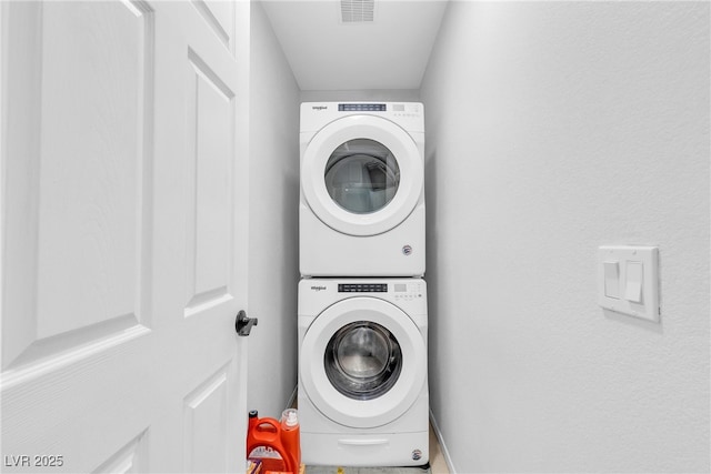 9074 Maycott Ave, Las Vegas, NV 89148 - laundry room with estacked washer and dryer and baseboards